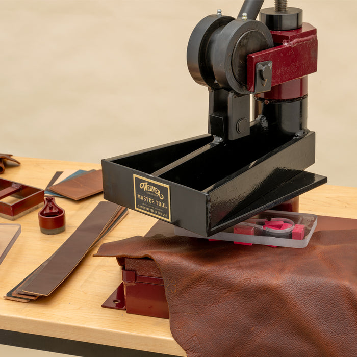 Mighty Wonder 4-ton clicker on a leatherworking workbench.